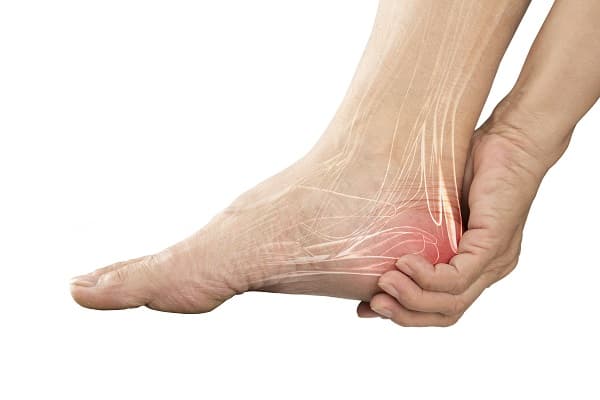 Person holding their painful foot, Yonkers NY